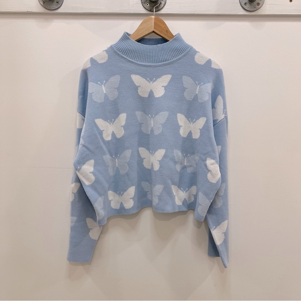 Blue sweater with butterflies